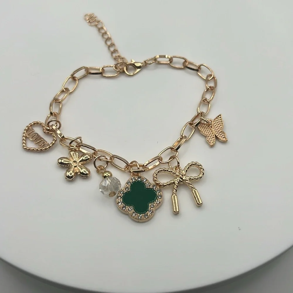 855. Gold Charm Bracelet with Green Clover